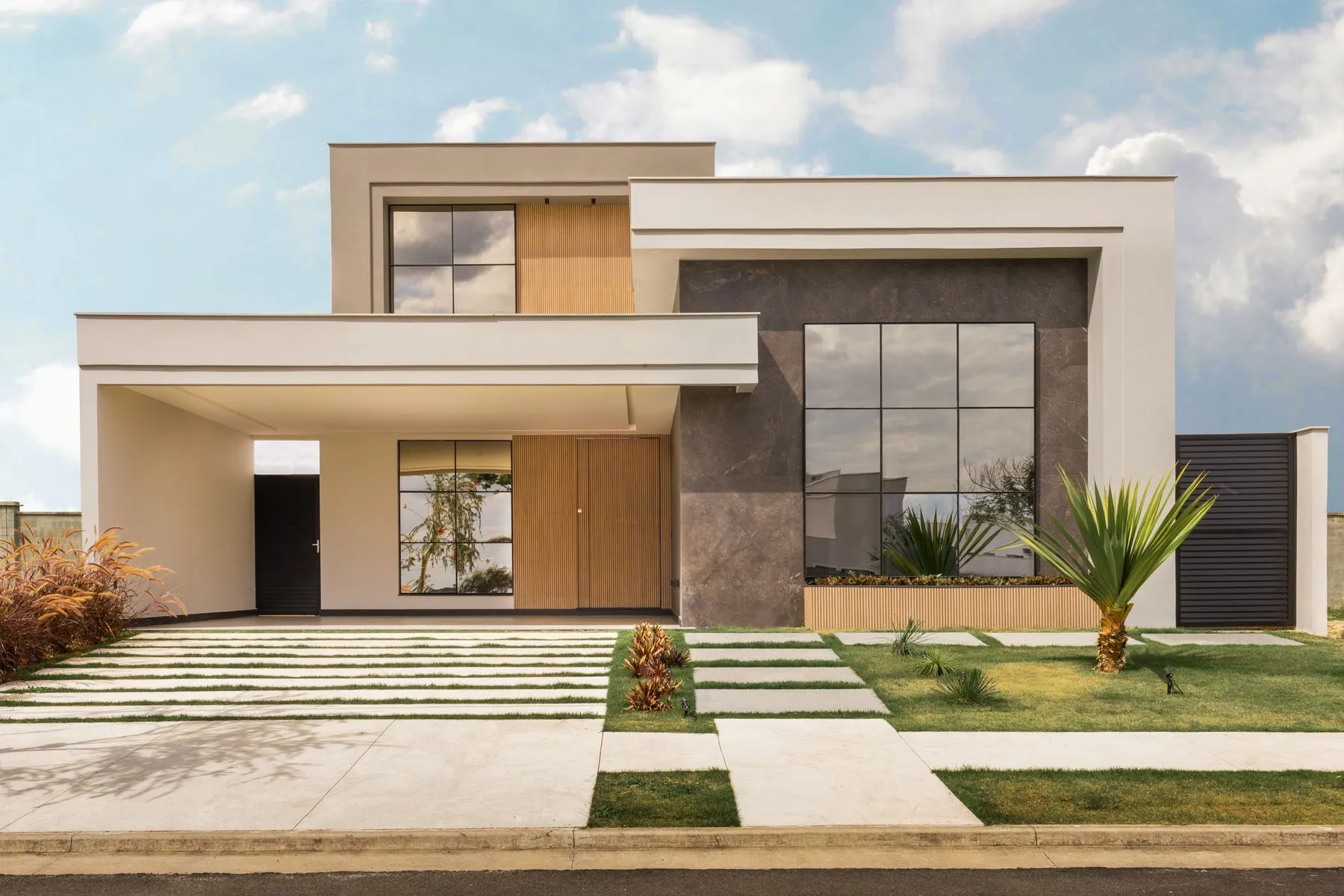Casa moderna de dos plantas con jardín y entrada de vehículos
